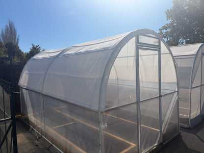 Harfords Home Gardener Shade Cover fitted over a tunnel house, three-quarter exterior view